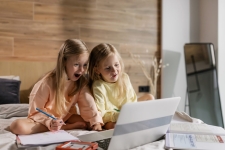 ABCMouse.com resource image showing two young girls on a laptop and smiling