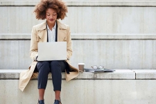 Gale Udemy resource image showing a woman sitting on stone steps with a laptop on her lap