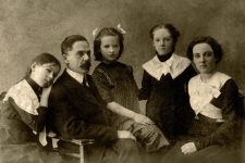 HeritageQuest Online resource black and white historical image of what looks to be a family: a mother, father, and three children