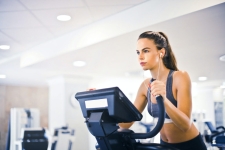 Health Source: Consumer Edition resource image showing a woman in athletic attire on an elliptical machine