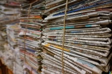 Newspapers.com Library Edition - World Collection resource image showing stacks of newspapers