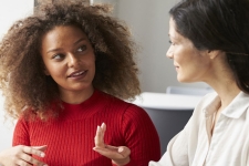 TeachingBooks resource image showing two women mid conversation