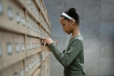 WISCAT resource image showing a young girl looking in a catalog drawer