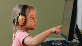 A child playing at an AWE Station