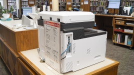 A fax machine sits on the 2nf floor reference desk.