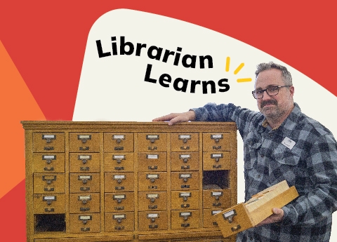 Librarian posing with shelf